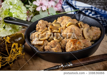 Meatballs served with pickled cucumber. Meatballs served with pickled cucumber. 108636866