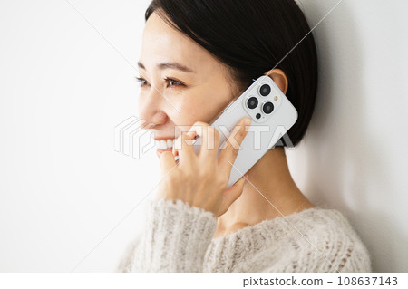 Young woman talking on smartphone Lifestyle image Young woman talking on smartphone Lifestyle image 108637143