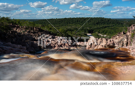 Blood Red Silky Water in the Roncador River with Cascades and Jungle Surrounding Blood Red Silky Water in the Roncador River with Cascades and Jungle Surrounding 108637754