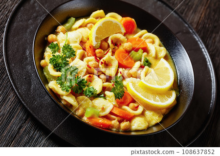 orecchiette pasta chickpea soup in black bowl orecchiette pasta chickpea soup in black bowl 108637852