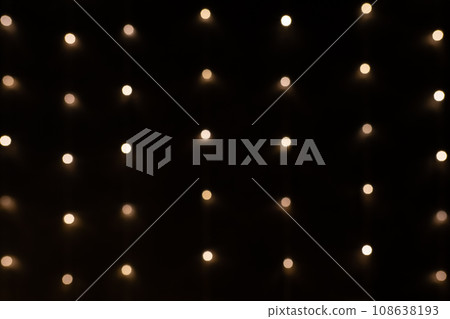 Golden holiday glowing backdrop. Defocused bokeh background 108638193