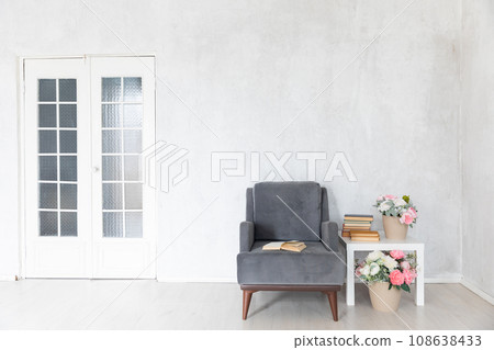 Grey armchair and coffee table in white room interior Grey armchair and coffee table in white room interior 108638433