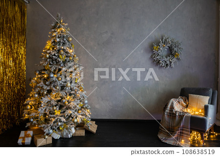Christmas tree with red gifts in the white room Christmas 108638519