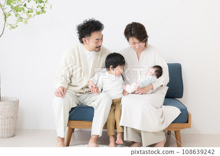 Image of a happy smiling family of four with two children, with copy space 108639242
