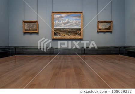 Collection of Paintings gallery displayed on blue wall in art exhibition inside The National Gallery. Collection of Paintings gallery displayed on blue wall in art exhibition inside The National Gallery. 108639252