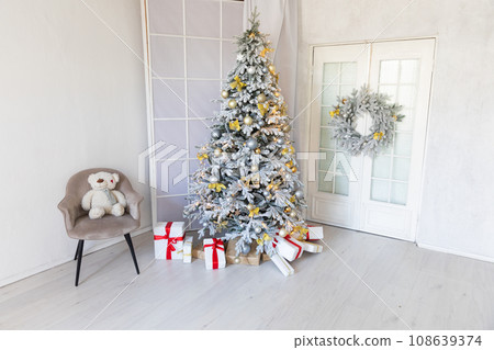 Decorated christmas tree with toys, garlands and gifts for new year Decorated christmas tree with toys, garlands and gifts for new year 108639374