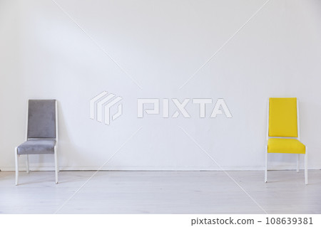 Two chairs in the interior of an empty room 108639381