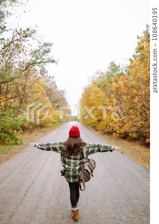 Travel woman hitchhiking. Rest, relaxation, travel, lifestyle concept. Travel woman hitchhiking. Rest, relaxation, travel, lifestyle concept. 108640195