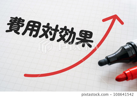 Notebook and marker that says cost-effective 108641542