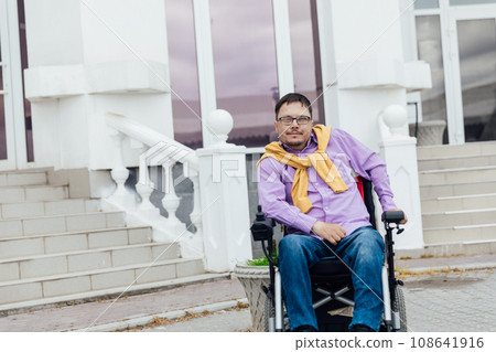 A person on the street near the building 108641916