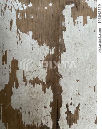 peeled paint on a wooden wall as a vintage background peeled paint on a wooden wall as a vintage background 108642539