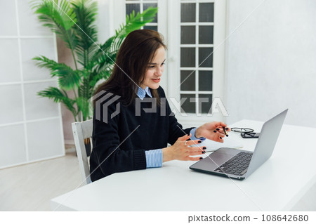 chat online via internet woman with laptop remote work chat online via internet woman with laptop remote work 108642680