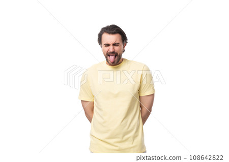 young handsome european man with beard and mustache shows tongue on white background with copy space young handsome european man with beard and mustache shows tongue on white background with copy space 108642822