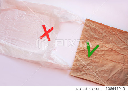 Blank plastic bag vs brown recyclable paper pack. Say no to plastic. Reduce, reuse and recycle concept.Eco friendly bag. Blank plastic bag vs brown recyclable paper pack. Say no to plastic. Reduce, reuse and recycle concept.Eco friendly bag. 108643043