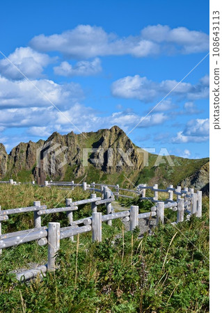 Rocky mountains, promenade and blue sky 108643113