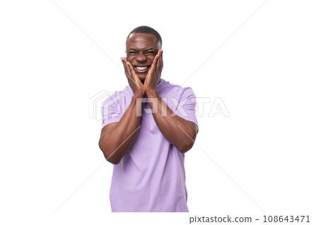 young shy handsome american man dressed in a light lilac basic t-shirt on a white background with young shy handsome american man dressed in a light lilac basic t-shirt on a white background with 108643471