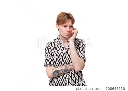 a young european guy with red hair in a shirt feels anxious 108643630
