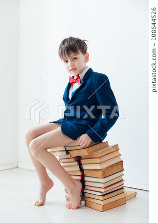 child sitting on books gets knowledge learning reading science 108644526