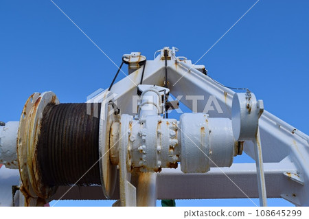 Close-up of ferry winch and blue sky (horizontal composition) 108645299