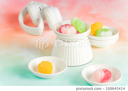 Gummies placed on a colorful background board. 108645414