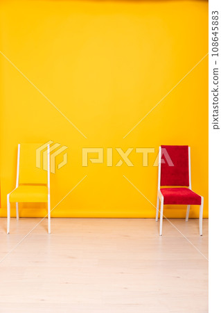 yellow and red chairs as backgrounds in the room interiors 108645883