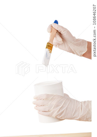 white paint with a brush painting a wooden background with texture white paint with a brush painting a wooden background with texture 108646207