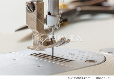 Sewing machine needle with thread and fabric 108646250