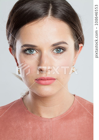 Nice brunette woman with makeup and natural healthy skin close up portrait 108646553