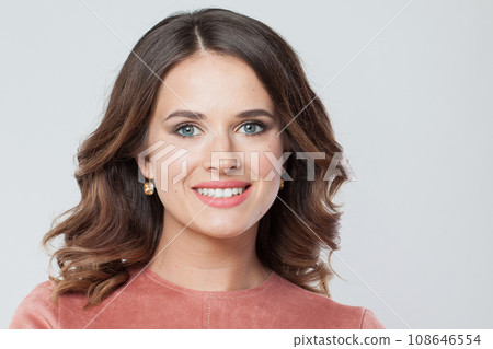 Cheerful female face closeup. Young brunette woman with makeup and natural healthy skin portrait Cheerful female face closeup. Young brunette woman with makeup and natural healthy skin portrait 108646554