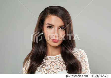 Young woman brunette with long healthy shiny dark brown straight hair, clean skin and makeup 108646872