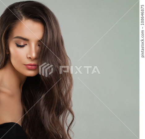 Fashion beauty portrait of young perfect female model brunette with long curly hairstyle. Fashion beauty portrait of young perfect female model brunette with long curly hairstyle. 108646875