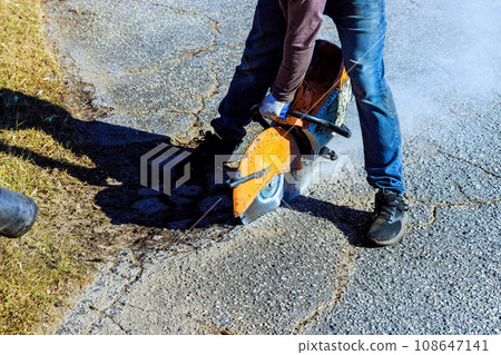 Repairing damaged asphalt cracks before installing new layer asphalt is part of road restoration Repairing damaged asphalt cracks before installing new layer asphalt is part of road restoration 108647141