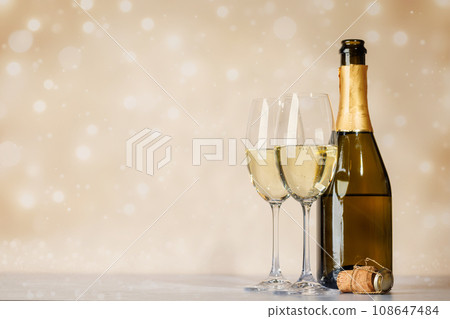 Two champagne glasses and bottle Two champagne glasses and bottle 108647484