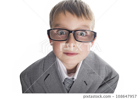 Portrait of a funny child boy wearing glasses against a white background. Portrait of a funny child boy wearing glasses against a white background. 108647957