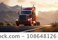 American style truck on freeway pulling load. Sun rays shine on the top of the mountain peaks, a picturesque landscape at sunset.  108648126