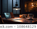 The workplace of a manager, designer or IT specialist, work at home, a laptop and a cup of tea or coffee on the table, a cinematic image in a cafe near at home. 108648129