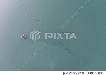 Sand mining platform on the water. Aerial view of an industrial landscape. Sand mining platform on the water. Aerial view of an industrial landscape. 108648895