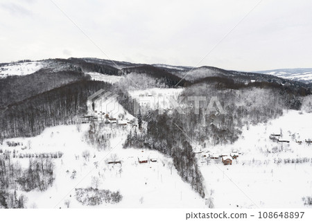 Aerial view of winter mountains. Monochrome color photography. Copy past background or wallpaper. 108648897