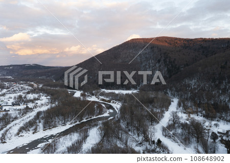 Aerial view of winter mountains. Aerial view of winter mountains. 108648902