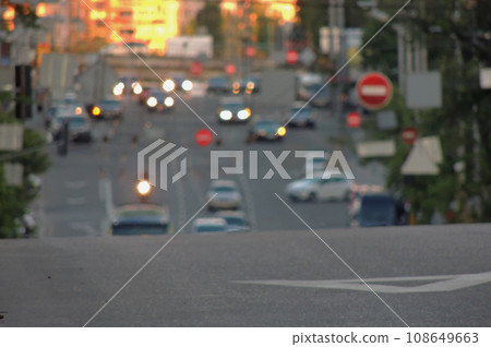 Blurred Street With Cars And Road Signs Background  108649663