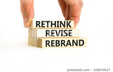 Rethink revise rebrand symbol. Concept word Rethink Revise Rebrand on beautiful block. Beautiful white table white background. Business brand motivational rethink revise rebrand concept. Copy space. 108650027