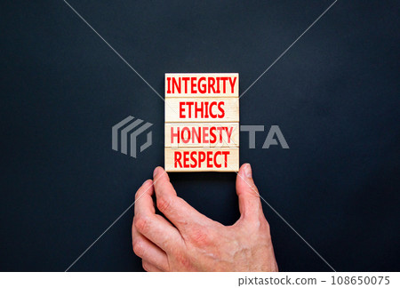 Integrity ethics honesty respect symbol. Concept word Integrity Ethics Honesty Respect on block. Beautiful black background. Businessman hand. Business integrity ethics honesty respect concept. Integrity ethics honesty respect symbol. Concept word Integrity Ethics Honesty Respect on block. Beautiful black background. Businessman hand. Business integrity ethics honesty respect concept. 108650075
