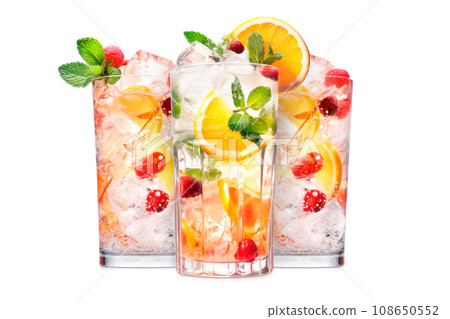 Set of crafted cocktails with berries, a slice of orange, ice cubes and a sprig of mint 108650552