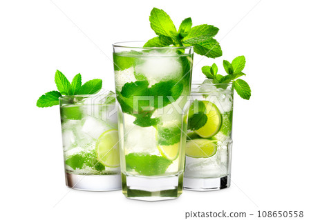 Set of Mojito cocktails, garnished with fresh mint and a slice of lime in a tall glass 108650558