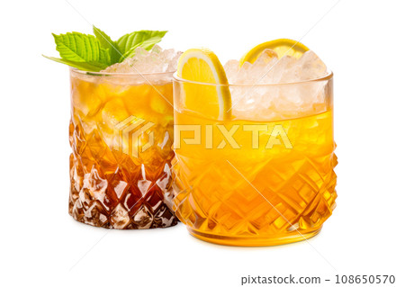 Set of Mai Tai cocktails in a classic tiki glass with crushed ice and a fresh mint 108650570