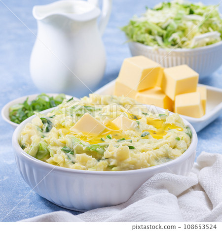 Delicious homemade Irish dish Colcannon or mashed potato with green cabbage and butter, square 108653524