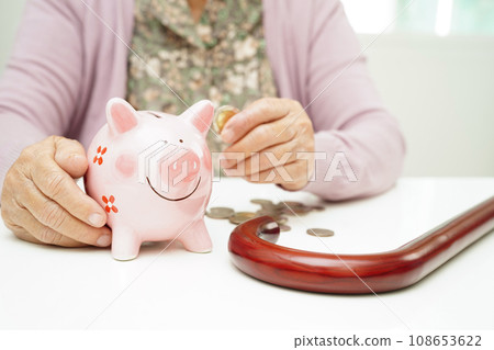 Retired elderly woman holding Euro banknotes money and worry about monthly expenses and treatment fee payment. 108653622