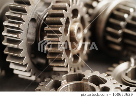 Metal gear wheel engine car and bike, mechanic industry concept. Metal gear wheel engine car and bike, mechanic industry concept. 108653629