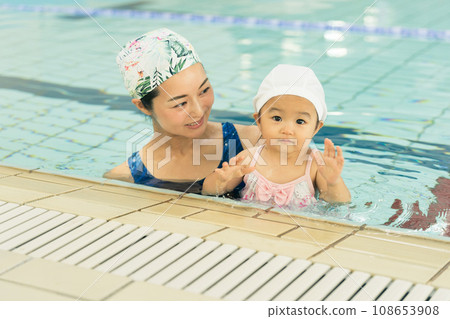 Baby swimming 108653908