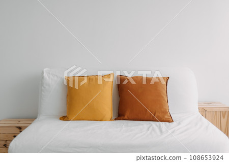 Simple minimal sofa decorated with pillows in white living room. Simple minimal sofa decorated with pillows in white living room. 108653924
